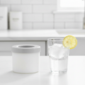 Gray sparkling water in a FrostCylinder premium silicone ice cup and mold maker by ARMPOWER IN MY HANDS.