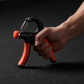 Orange ARMPOWER IN MY HANDS ForearmPro 3-piece adjustable grip strengtheners for hand and arm muscle training.